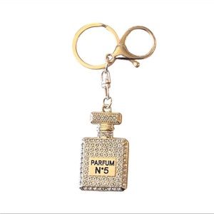 NEW-Unbranded No. 5 Gold Parfume
Keychain/Bag Charm.